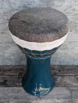 Doumbek with a hand made stoneware shell and skirted fish skin drum head.
