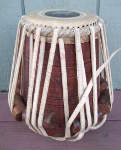 A tabla dayan with a damaged pudi.
