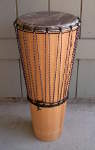 An ashiko drum just mounted with a fresh African goatskin.