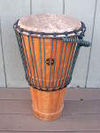 An ashiko hand drum with a fresh African goat skin and new rope.