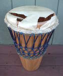 Ashiko drum with a torn drum head.