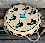 An octagonal two headed drum with a repaired frame and new lacing.