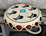 A two headed Native American drum with a repaired frame and new laces.