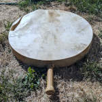 Qilaut frame drum witha torn drum head.