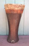 African peg drum with a torn skin.