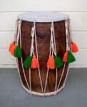 A dhol with a brand new drum head mounted.